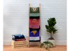 Nice Blanket Signature Memory Quilts made from Minnesota sports shirts, featuring the Wild, Gophers, Vikings, Timberwolves, and Twins, folded on a wooden ladder and stacked on a crate.