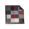 Nice Blanket Signature Memory Quilt made from plaid shirts in a mix of navy, red, green, gray, black, and white patterns in a 16 square grid, with a black backing folded over at the upper right corner.