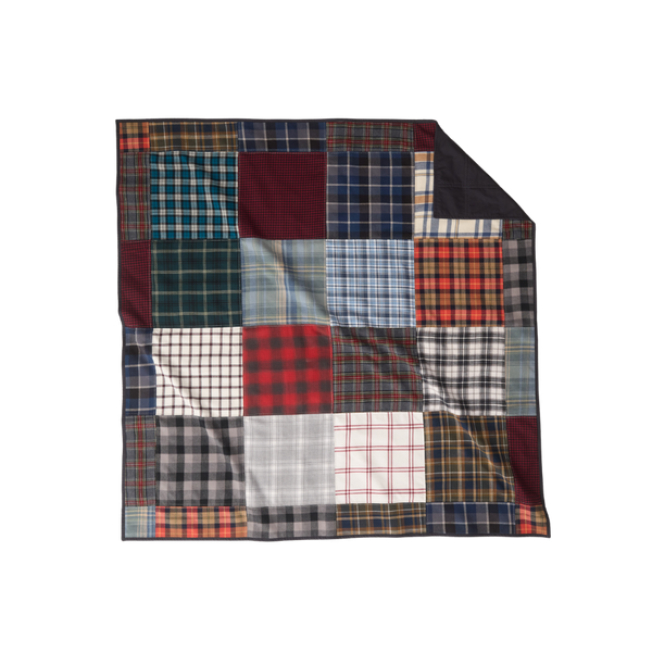 Nice Blanket Signature Memory Quilt made from plaid shirts in a mix of navy, red, green, gray, black, and white patterns in a 16 square grid, with a black backing folded over at the upper right corner.