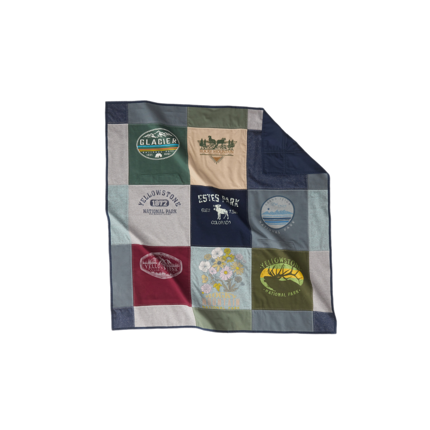 Nice Blanket Signature Memory Quilt made from national park and travel-themed shirts in navy, green, gray, burgundy, and tan, featuring Glacier, Rocky Mountain, Yellowstone, Estes Park, and Grand Teton designs in a 9-square grid.