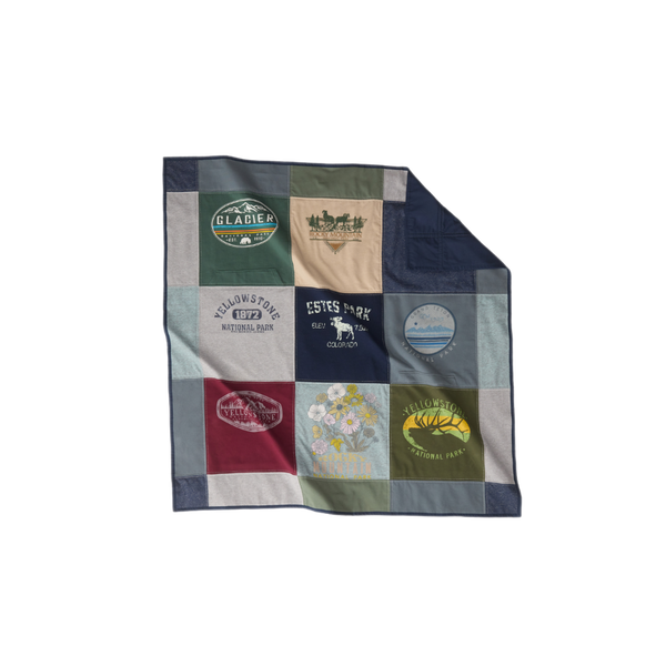 Nice Blanket Signature Memory Quilt made from national park and travel-themed shirts in navy, green, gray, burgundy, and tan, featuring Glacier, Rocky Mountain, Yellowstone, Estes Park, and Grand Teton designs in a 9-square grid.